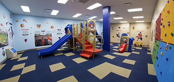 Daycare playground with indoor rock climbing wall