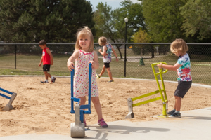 Children playing with digging toy at the playground