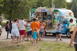 Food truck with line at the park