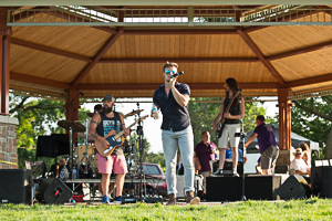 Musicians performing for audience in the park