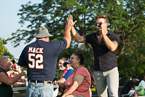 Emcee talking to concert goers